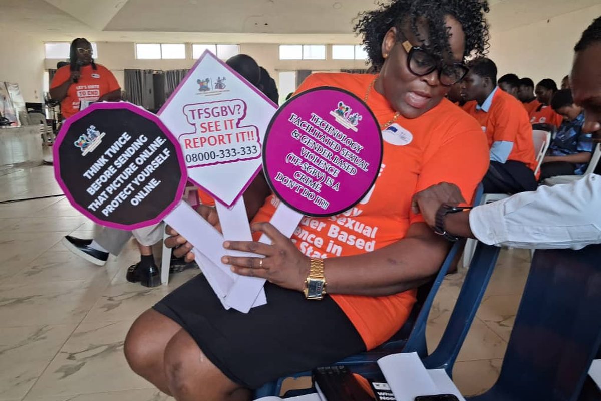 Dr Atinuke Akintayo and a colleague with the campaign placards.